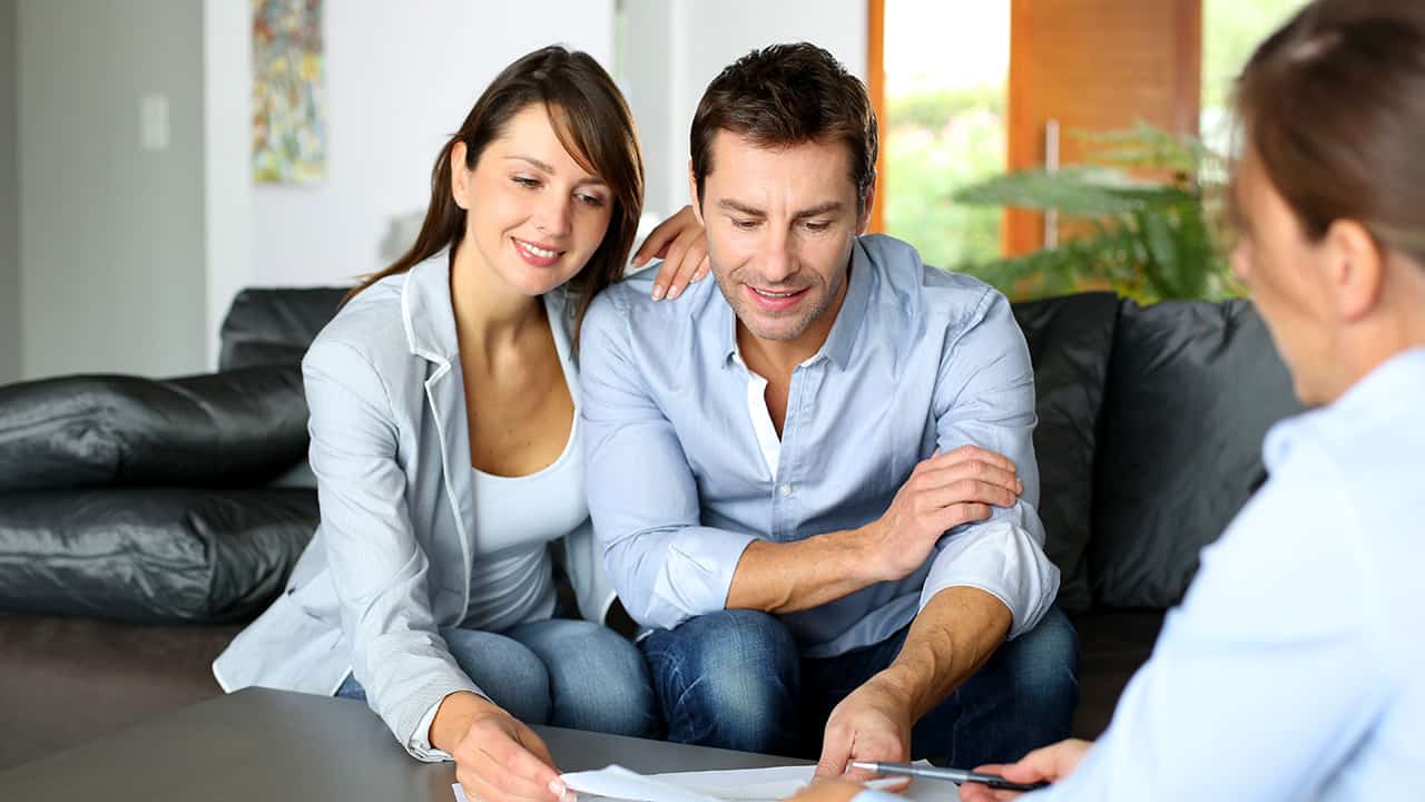 Couple looking at the benefits of HVAC maintenance plans